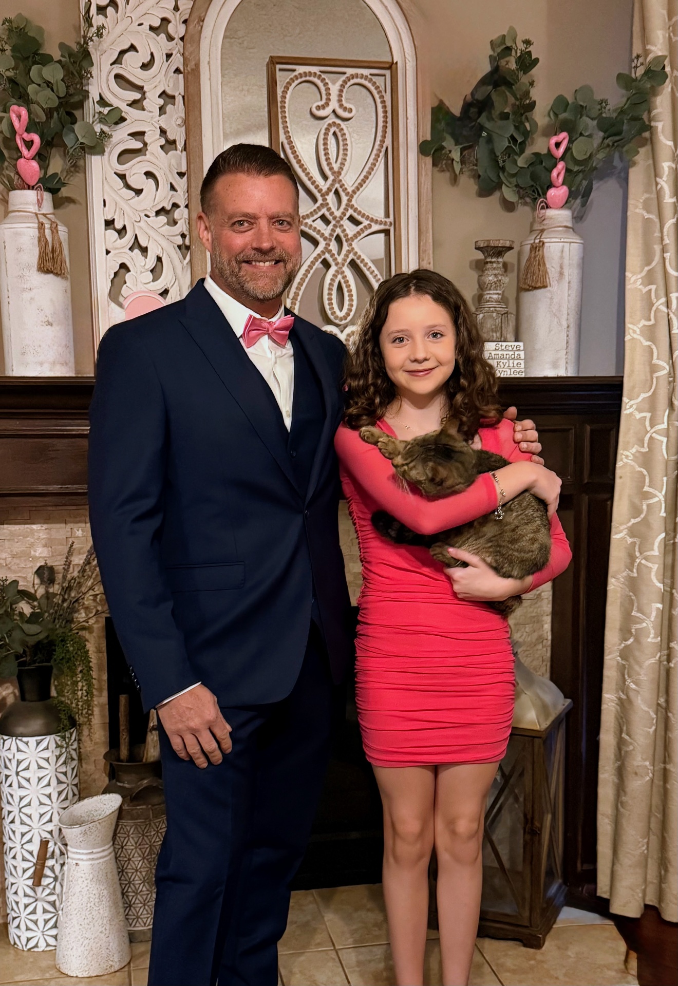 Dr. Pelton and daughter at a special event with their cat